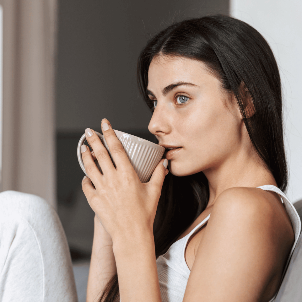 Woman drinking herbal tea for better sleep